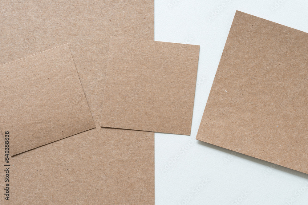 plain brown paper cardboard shapes on blank paper plain brown paper cardboard shapes on blank paper