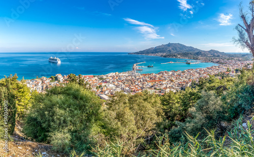 View of Zakynthos Zante town and harbor with cruise ship and turquoise water in Greece