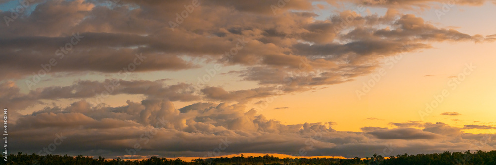 Panoramic sunset view in outback Queensland, Australia during autumn with dramatic clouds. 