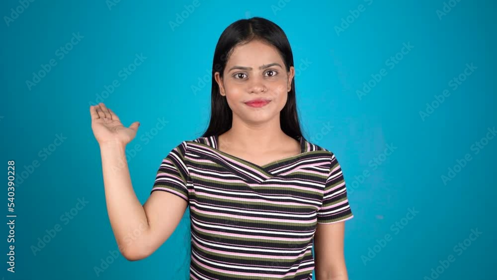 Portrait of attractive cheerful girl demonstrating copy empty space, isolated over color background pointing Portrait of attractive cheerful girl demonstrating copy empty space, isolated over color background pointing