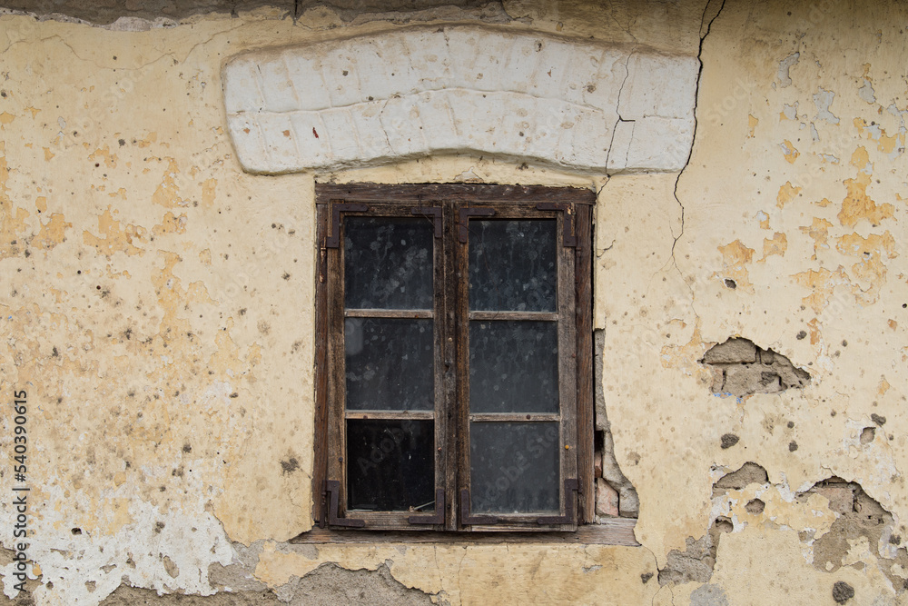 Croatia, October 20,2022 : Rustic style aged window at rural home wall.
