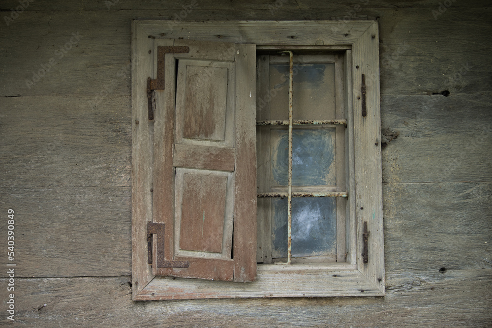 Croatia, October 20,2022 : Rustic style aged window at rural home wall.
Croatia, October 20,2022 : Rustic style aged window at rural home wall.