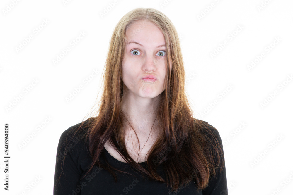 young and pretty blonde young woman grimacing with her mouth on white background young and pretty blonde young woman grimacing with her mouth on white background