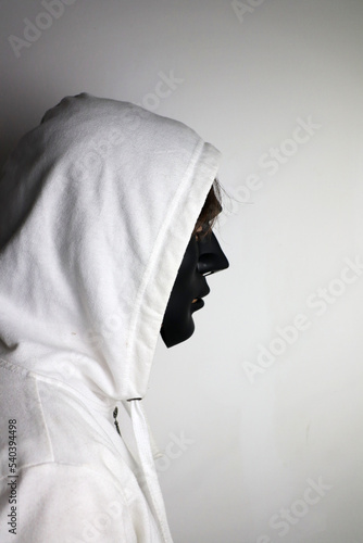 white person with black mask photo