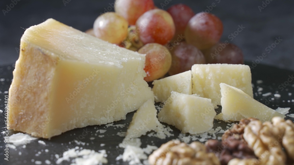 Cheese plate close-up with several varieties of fruit and cheese Cheese plate close-up with several varieties of fruit and cheese