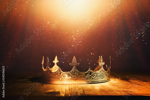 low key image of beautiful queen or king crown over wooden table Fototapet