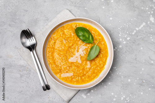 Canvas-taulu Risotto with pumpkin and pumpkin seeds, parmesan cheese and basil