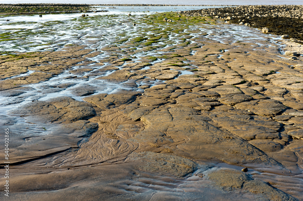 Stones and slabs at low tide on Lilstock beach, Somerset.