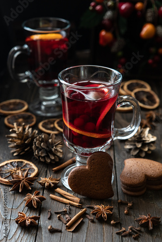 Glass with mulled wine and spices, selective focus with shallow depth of field