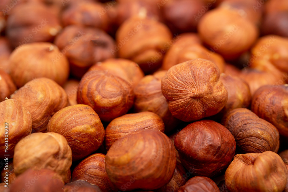 Heap of hazelnuts close-up. Peeled nuts. Hazelnut isolated on white background. Heap of hazelnuts close-up. Peeled nuts. Hazelnut isolated on white background.
