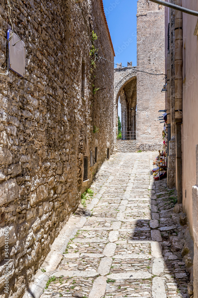 Erice, Sicily, Italy - July 10, 2020: Sicilian souvenirs. Ancient, typical narrow and cobblestone street in Erice, Sicily, Italy