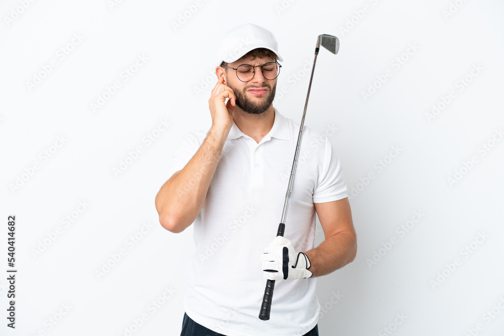 Handsome young man playing golf isolated on white background frustrated and covering ears Handsome young man playing golf isolated on white background frustrated and covering ears