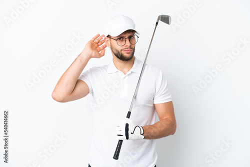 Handsome young man playing golf isolated on white background having doubts