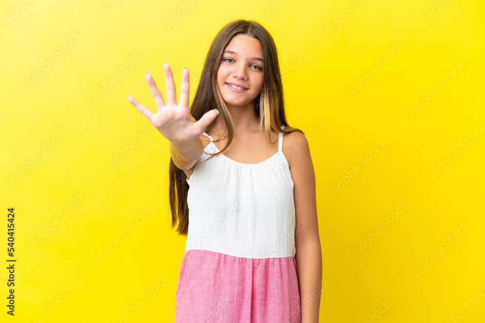 Little caucasian girl isolated on yellow background counting five with fingers Little caucasian girl isolated on yellow background counting five with fingers