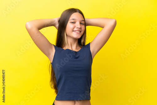 Little caucasian girl isolated on yellow background laughing