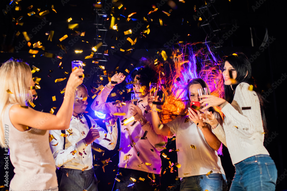 Friends celebrating with champagne