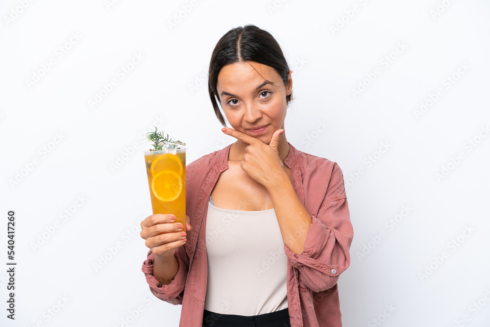 Young hispanic woman holding a cocktail isolated on white background happy and smiling Young hispanic woman holding a cocktail isolated on white background happy and smiling