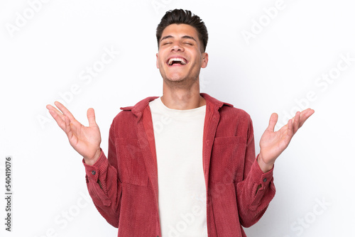 Young caucasian man isolated on white background smiling a lot