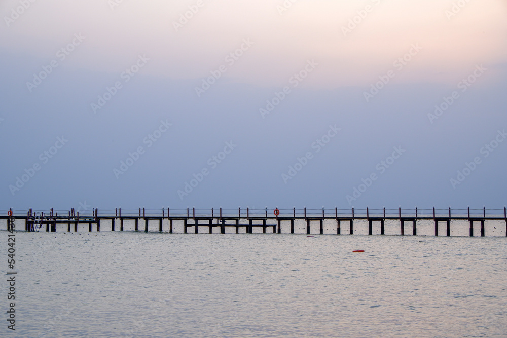 long wooden pier on the beach