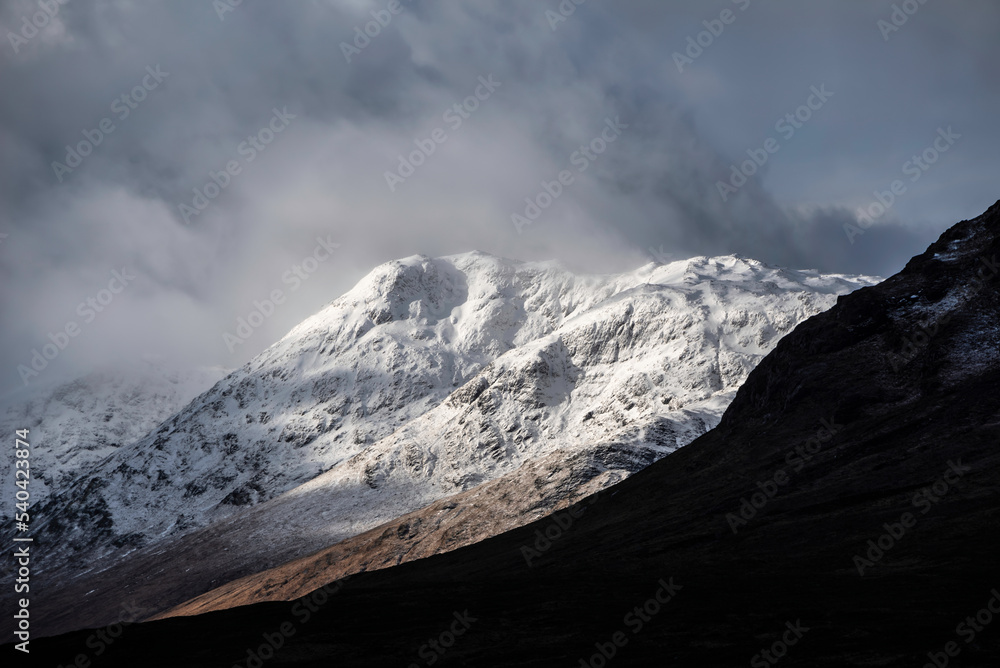 Majestic beautiful Winter landscape image of Lost Valley in Scotland with snowcapped Buachaile Etive Baeg sand distant mountain range with dramatic sky Majestic beautiful Winter landscape image of Lost Valley in Scotland with snowcapped Buachaile Etive Baeg sand distant mountain range with dramatic sky