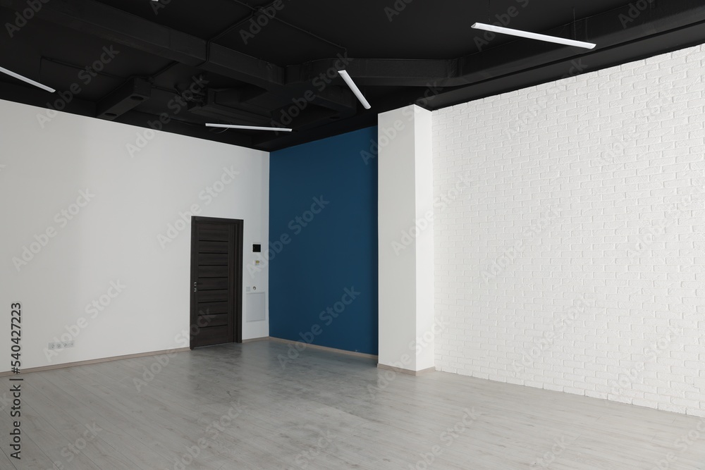 Empty office room with black ceiling and door. Interior design Empty office room with black ceiling and door. Interior design