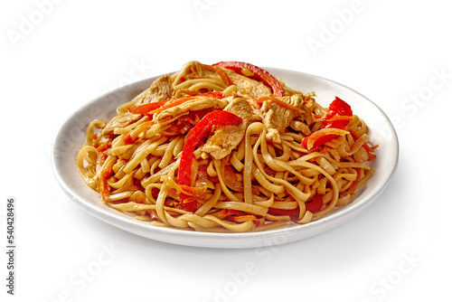 Chinese udon noodles with stir fried veal and vegetables served on plate