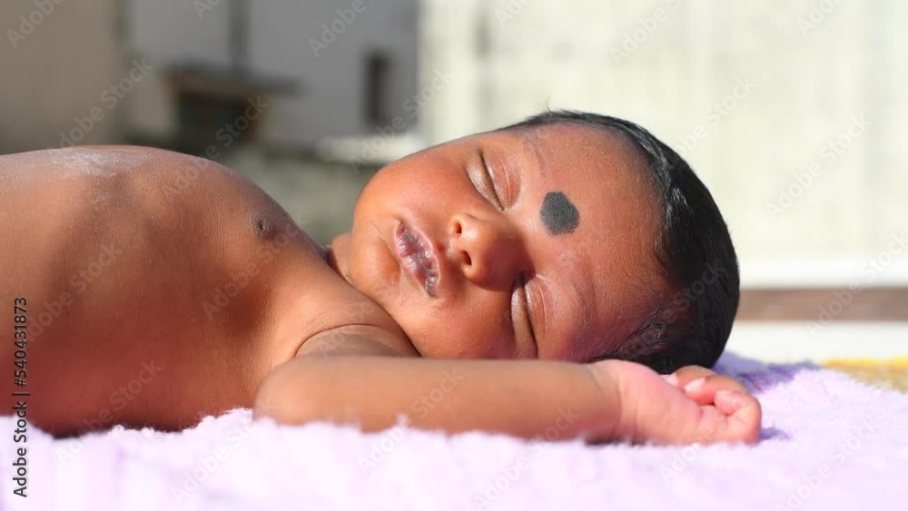 New Born Baby Laying On Direct Sunlight. Sun Exposure in Children