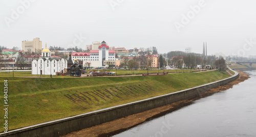 Vitebsk  Belarus - December 2019  View of the Church of the Annunciation of the Most Holy Theotokos and the Church of the Holy Prince Alexander Nevsky and a river from distance