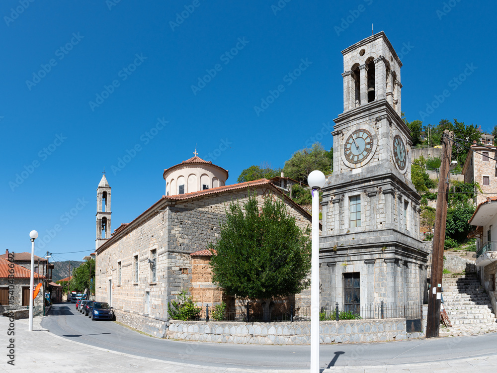 Church of Taxiarches (the greatest brigadiers) and bell clock tower in Lagadia village, Arcadia, Greece