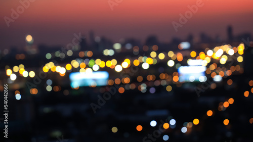 Blurred of bokeh city aerial view from the rooftop view point image in the night © SASITHORN