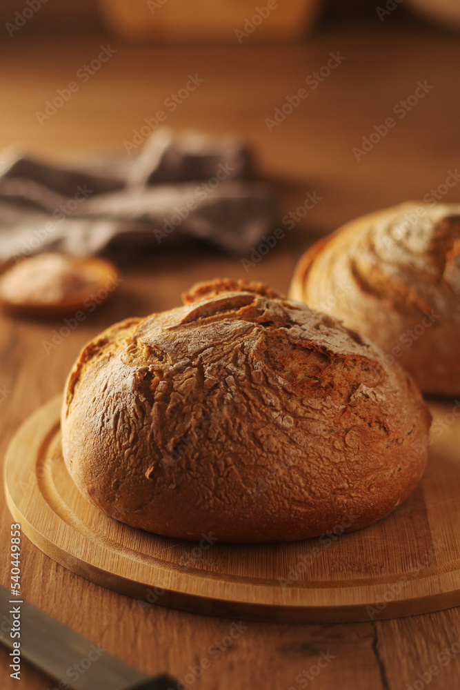 A loaf of rye bread in low key	