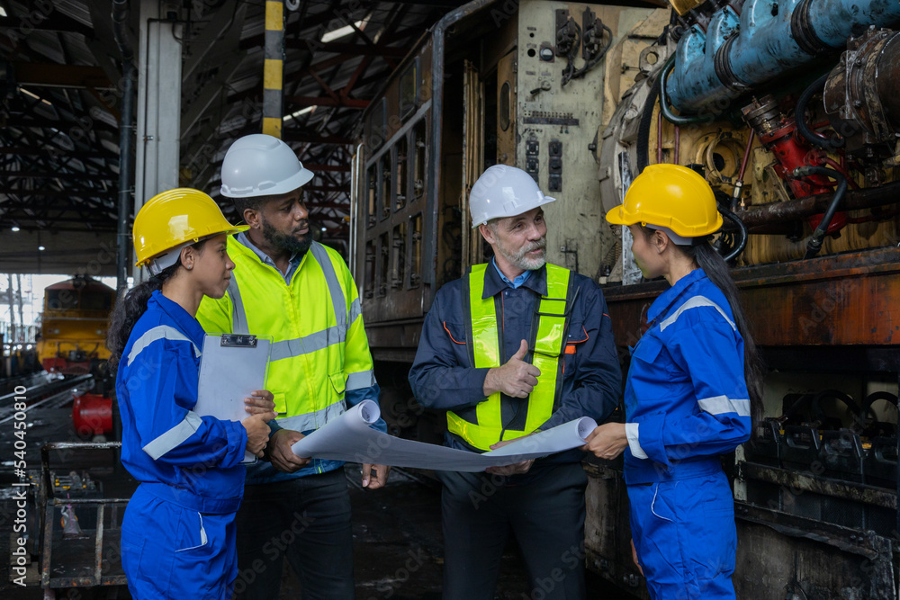 Railway engineer inspects diesel engine Report on the progress of engine parts in the factory. with safety standards Railway engineer inspects diesel engine Report on the progress of engine parts in the factory. with safety standards