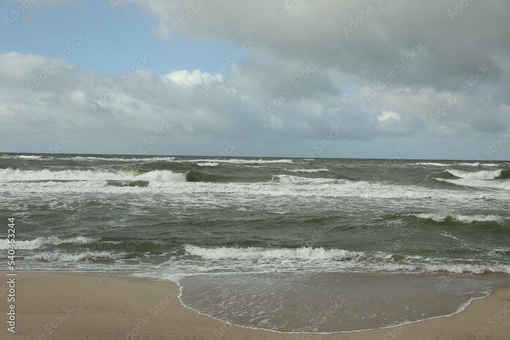 Picturesque view of wavy sea on cloudy day Picturesque view of wavy sea on cloudy day