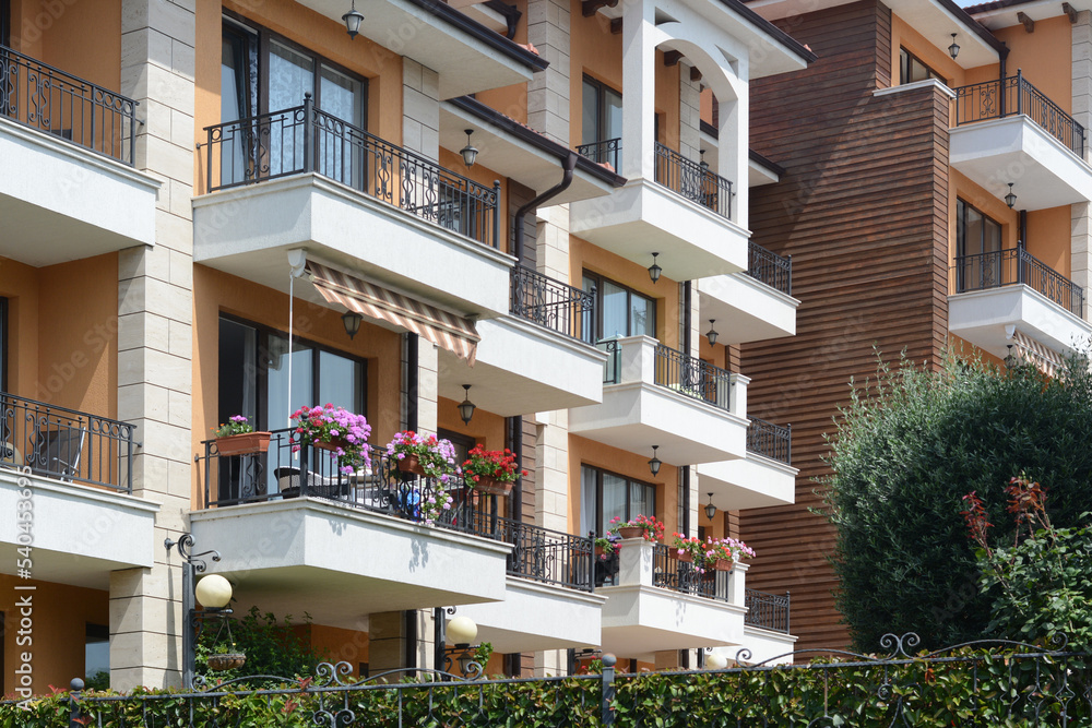 Fototapeta premium Exterior of building with balconies on sunny day