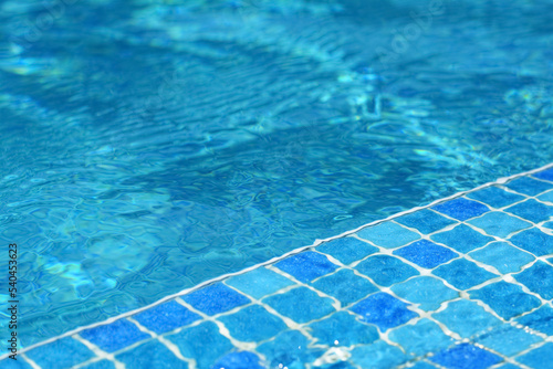 Clear refreshing water in swimming pool on sunny day, closeup