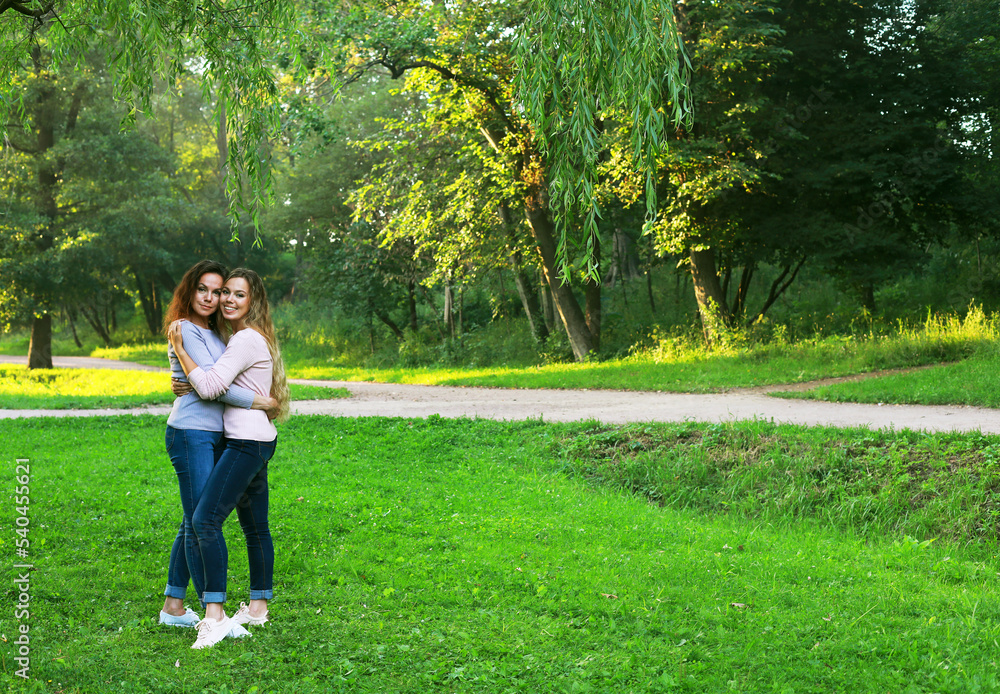 Mother and adult daughter in the park. Mother and adult daughter in the park.
