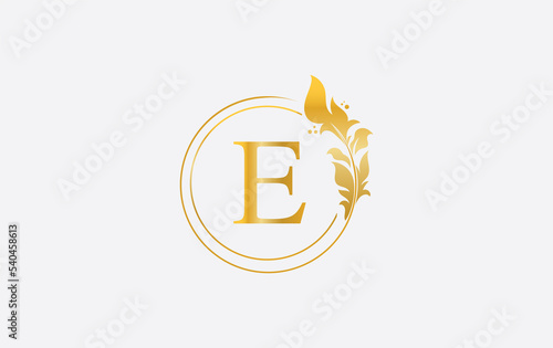 Golden leaf download and circle logo design image. Golden beauty and business symbol and alphabets design photo