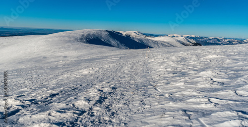 Western part of Low Tatras and Velka Fatra mountains from hiking trail above sedlo Durkovej in Slovakia during winter