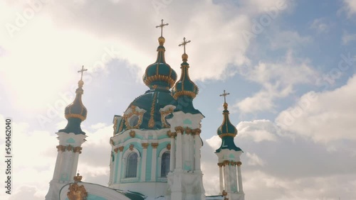 St Andrews orthodox church on blue sky background. Amazing decorative cathedral facade. photo