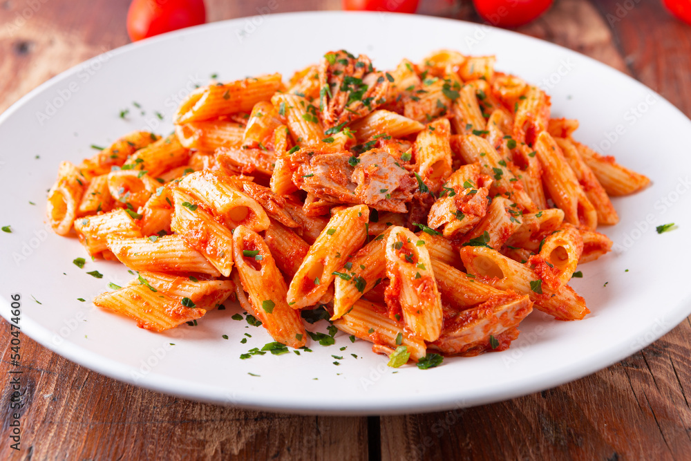 Pasta with tuna in tomato sauce, typical food of Mediterranean Italian cuisine. Pasta with tuna in tomato sauce, typical food of Mediterranean Italian cuisine.