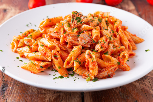 Pasta with tuna in tomato sauce, typical food of Mediterranean Italian cuisine.