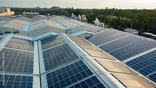 Footage over Solar cell on the roof of a large industrial factory. Solar roofs are generating renewable energy for the industry. The goal is to reduce the cost of electricity.
