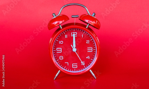 Red alarm clock on red background,with copy space