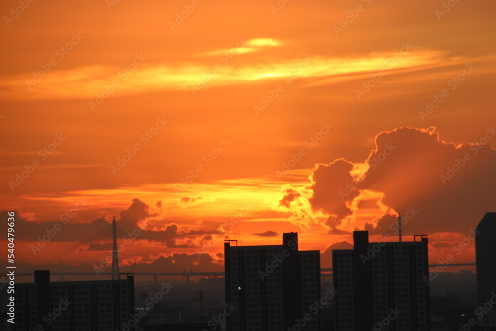 orange golden sunset clear sky background with town city view 