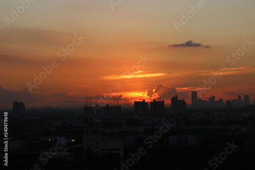 orange golden sunset clear sky background with town city view 
