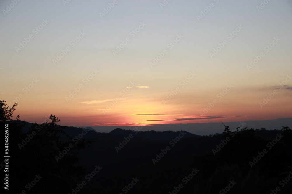 twilight evening time sunset sky background with mountain forest view twilight evening time sunset sky background with mountain forest view