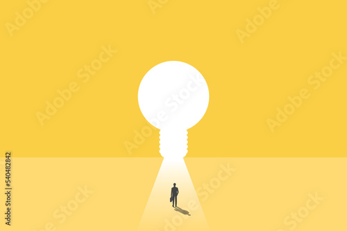 businessman walking through lightbulb shape door, creative concept