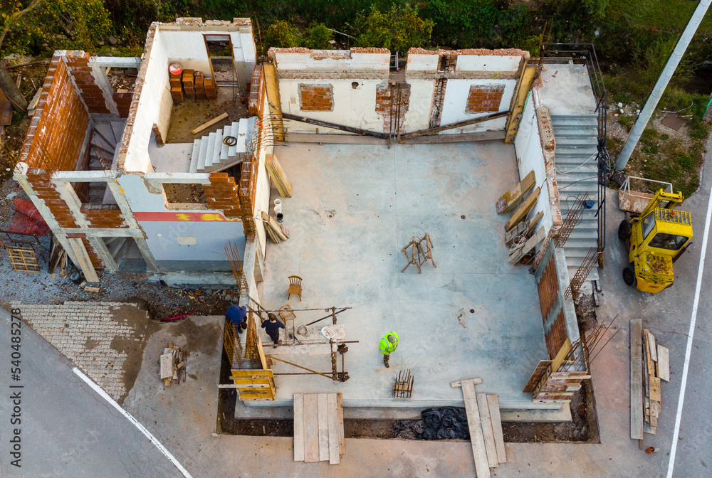 construction workers on a construction site construction workers on a construction site