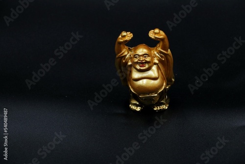Laughing Buddha.Chinese God of happiness, wealth and Luck, Isolated on black background