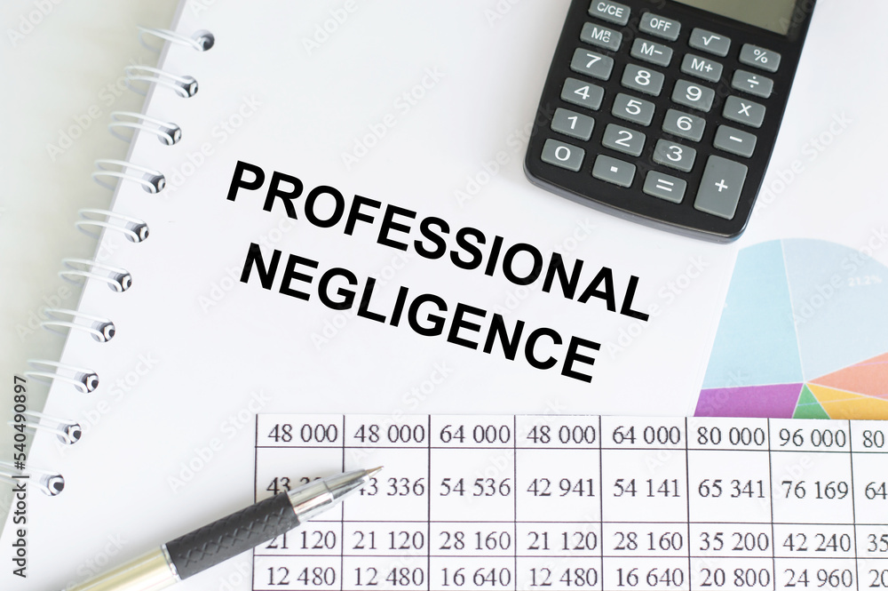 PROFESSIONAL NEGLIGENCE text written in notepad with pen on the table. Business concept. PROFESSIONAL NEGLIGENCE text written in notepad with pen on the table. Business concept.